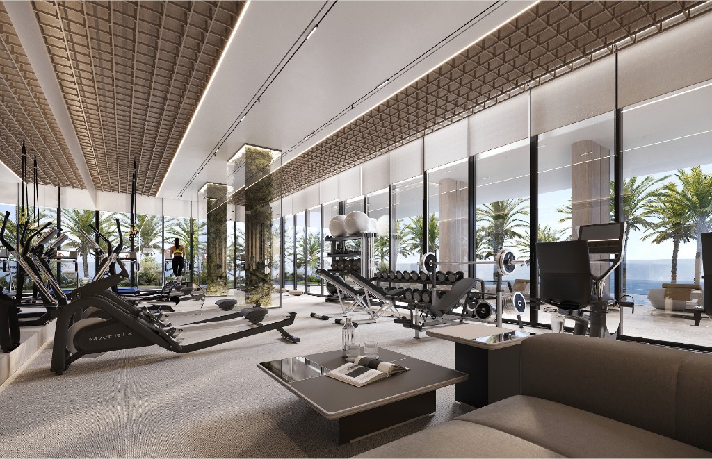 Gym with cardio equipment facing full-height glazing and palm views, Isolana