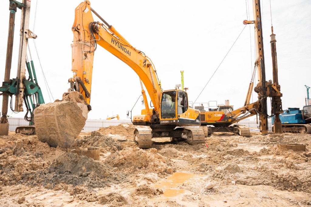 Excavator working on the Isolana Residences construction site