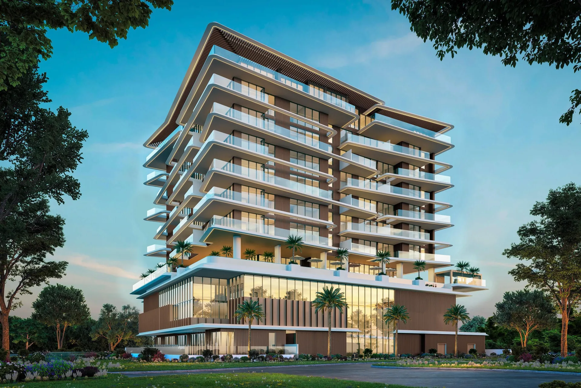 Isolana residences on Dubai Islands at dusk, its tiered balconies lit above a glazed podium