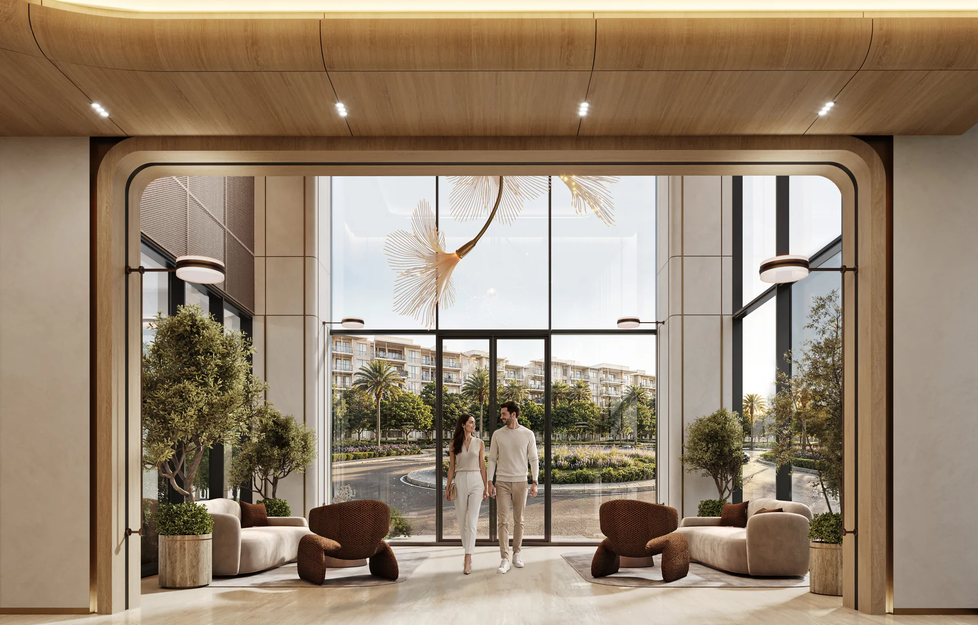 Double-height entrance lobby with sculptural seating and indoor trees